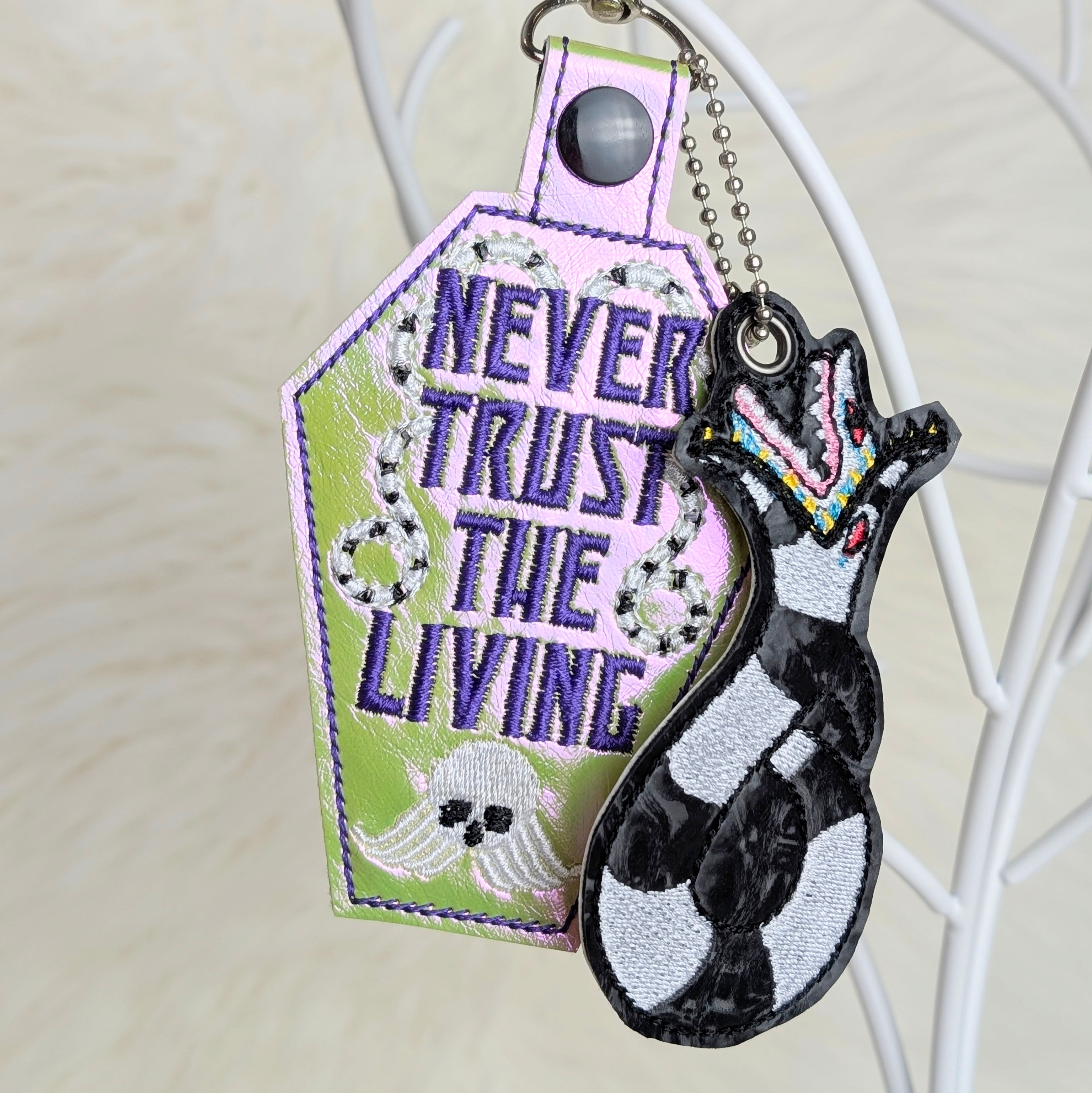 “Never Trust the Living” Coffin Snap Tab Keychain